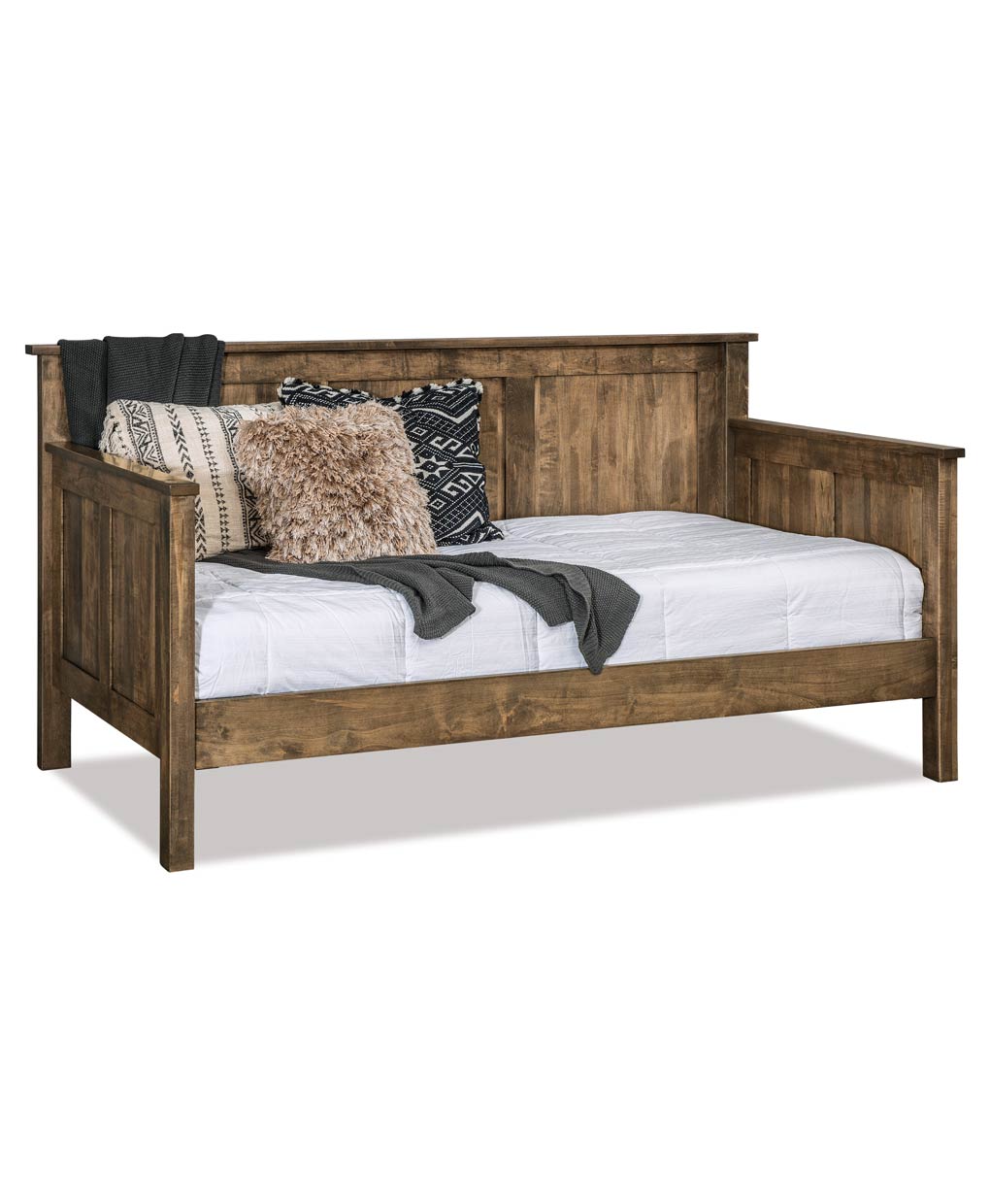 Wooden bed with white bedding and decorative pillows on a white background