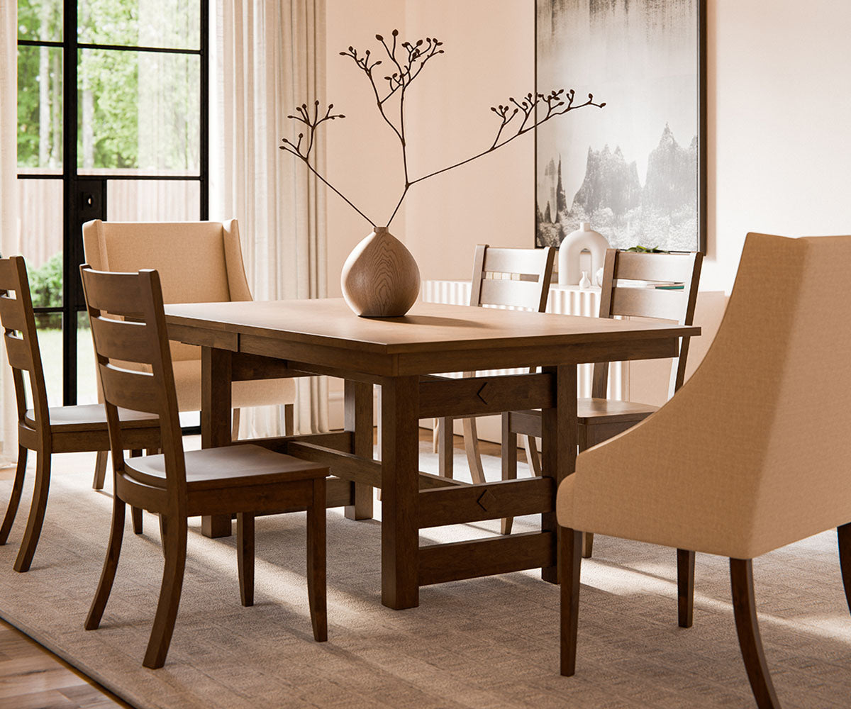 Dining room with wooden table and chairs in a well-lit room.