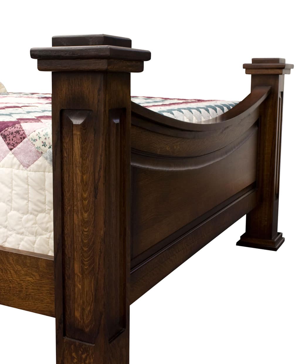 Wooden bed frame with intricate design on a white background
