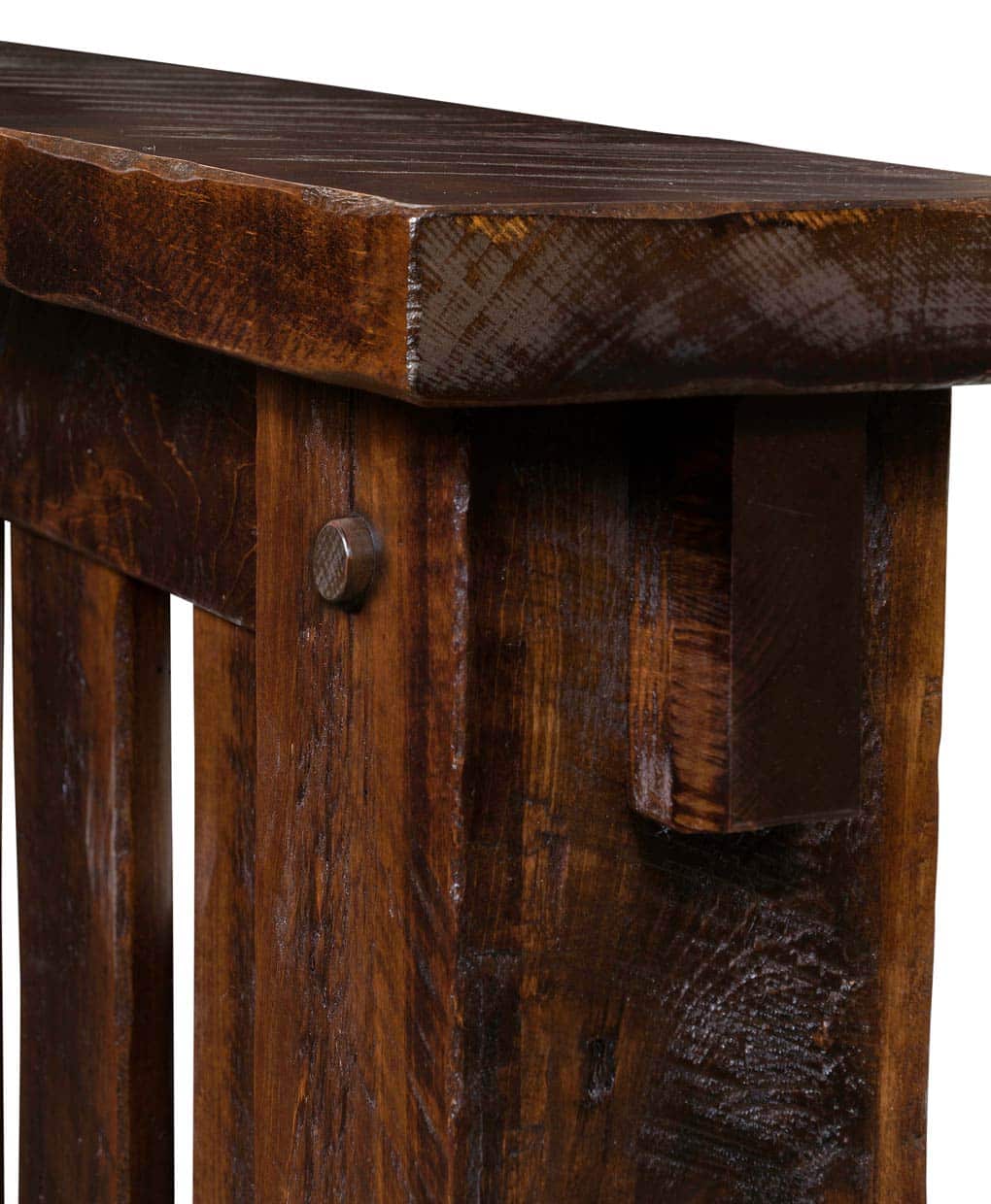 Close-up of a wooden table with a rustic finish