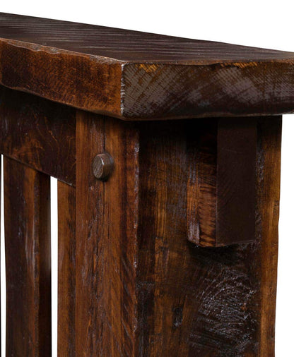 Close-up of a wooden table with a rustic finish