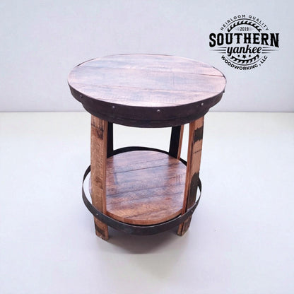 Round wooden side table with metal accents on a white background, featuring the Southern Yankee logo.